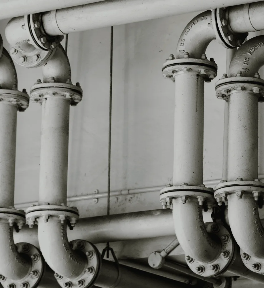 Rows of white insulated pipes