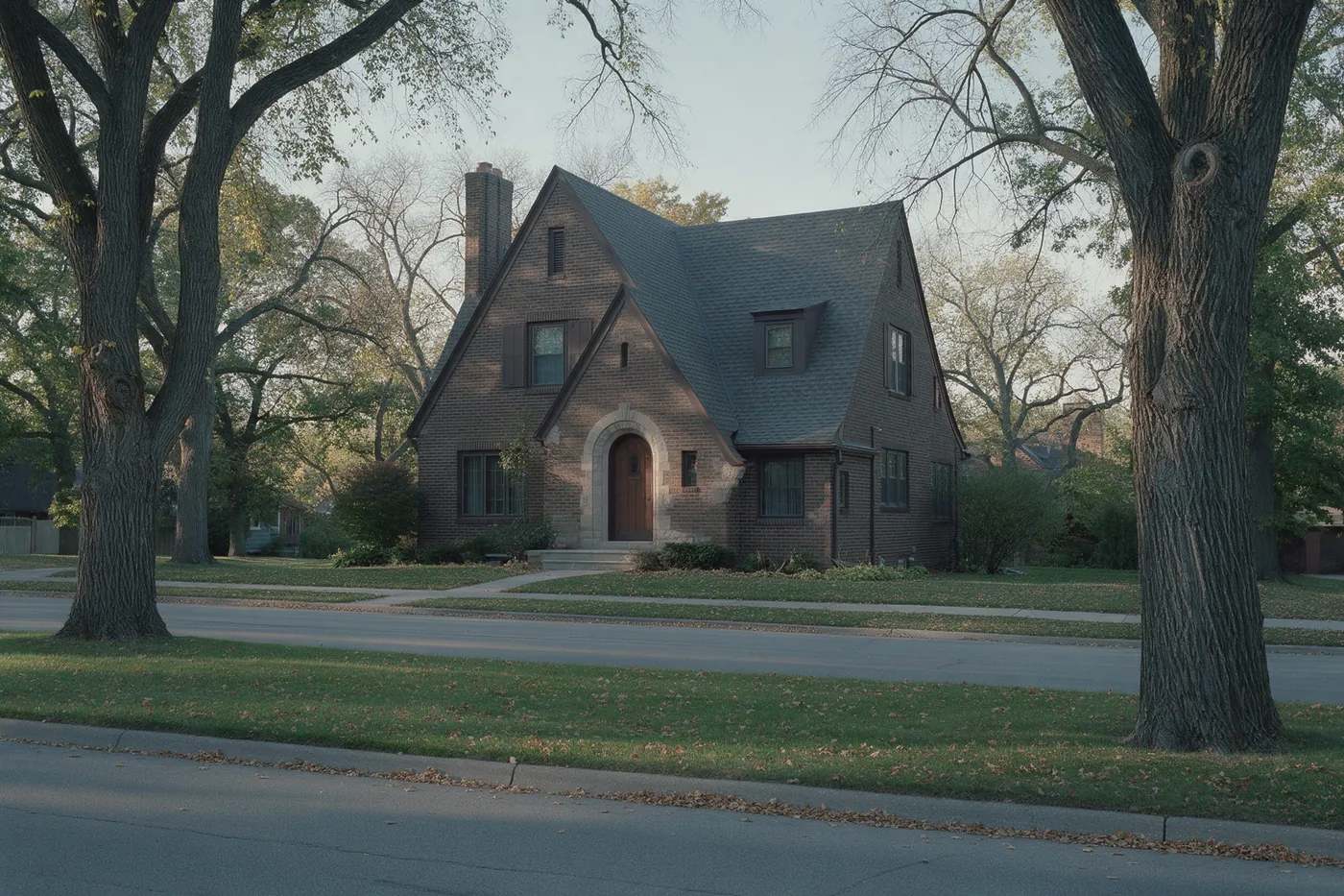 A brick Tudor house with a steep roof on a Park Hill corner