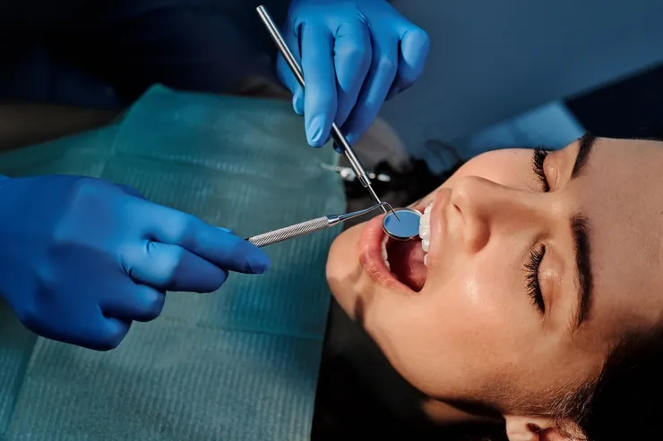 A dental check-up with a mirror and a probe