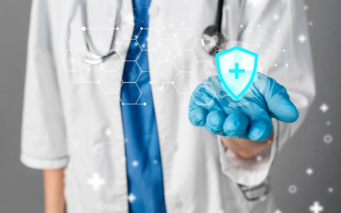 A doctor holding a glowing shield icon