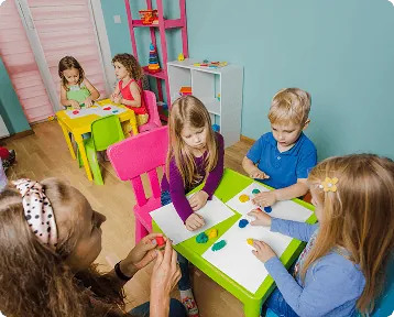 Children colouring at a craft table