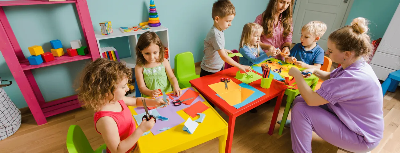 Children playing together in a bright classroom