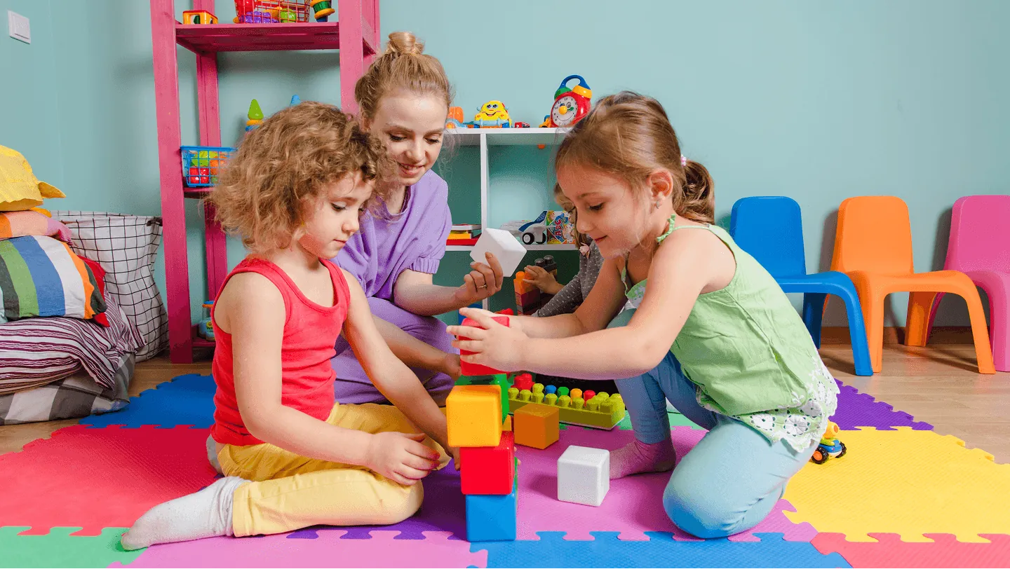 Children playing in a bright day care room