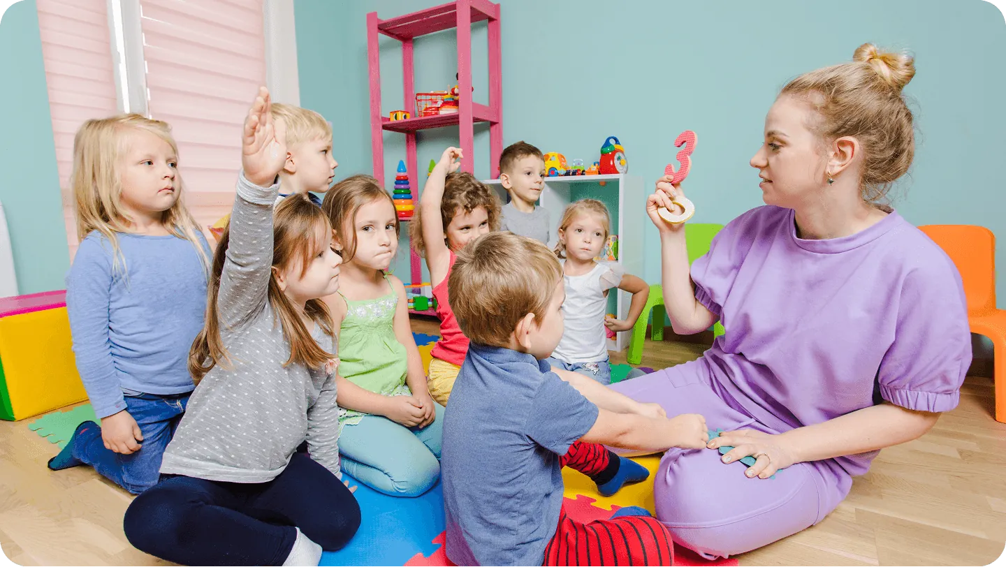 Kindergarten children playing on the floor