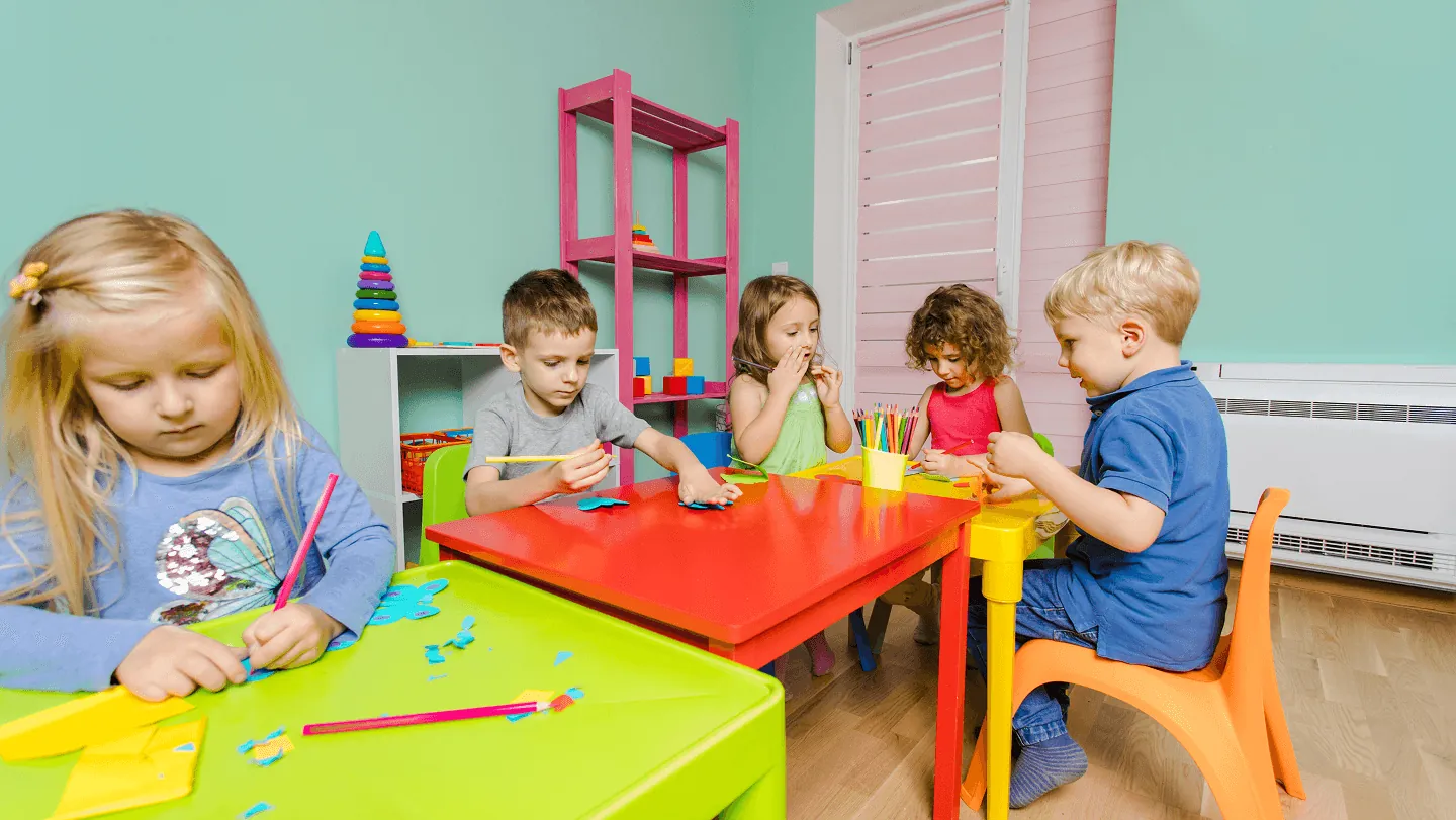 A child stacking colourful blocks