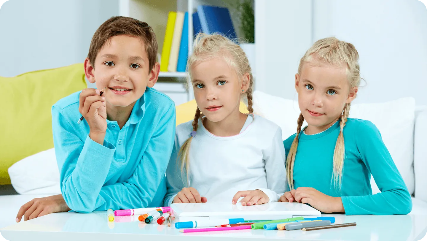 Children sharing toys in a group