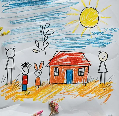 A child's crayon drawing of a house and a sun