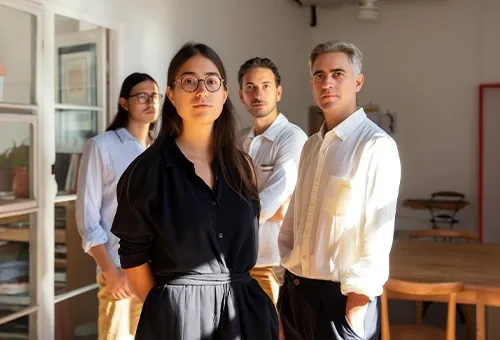 The four people of the practice in their office