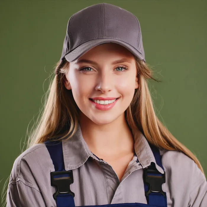 Emily Martinez, receptionist, in a cap and work overalls
