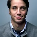 A client in a grey sweater