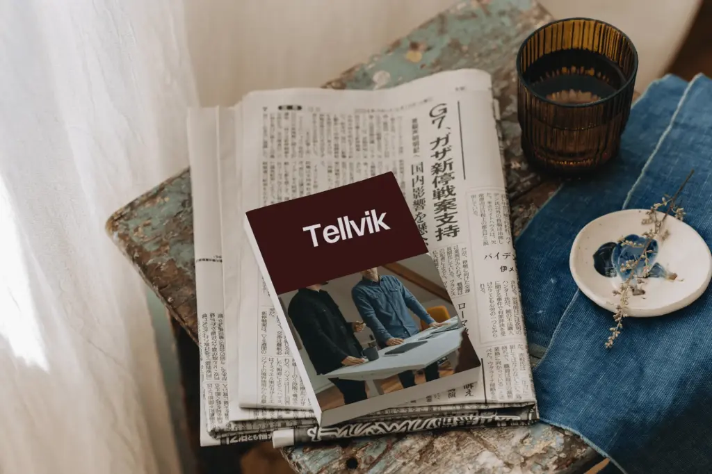 A Tellvik journal on a pile of newspapers