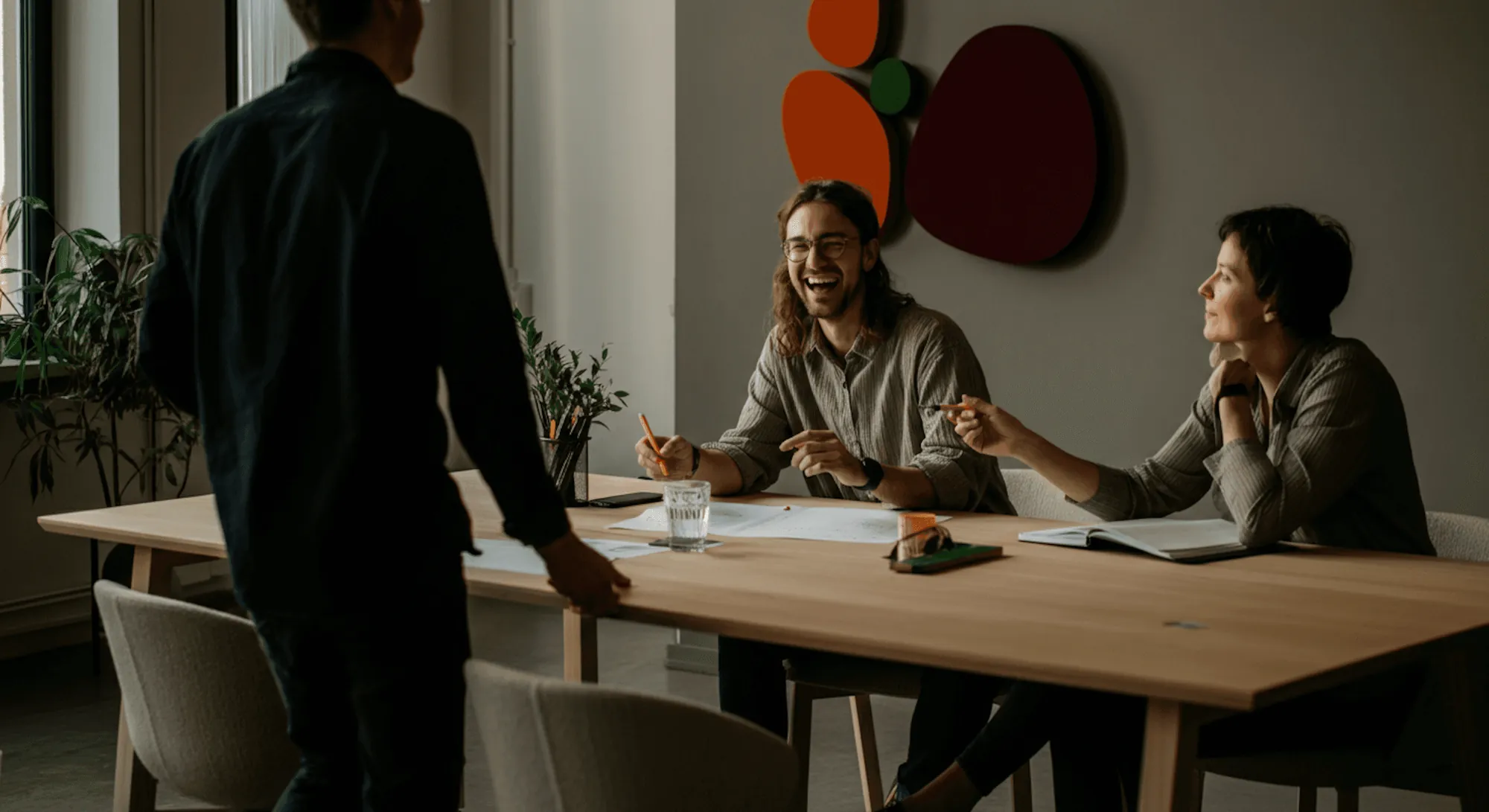 A team meeting around a long table