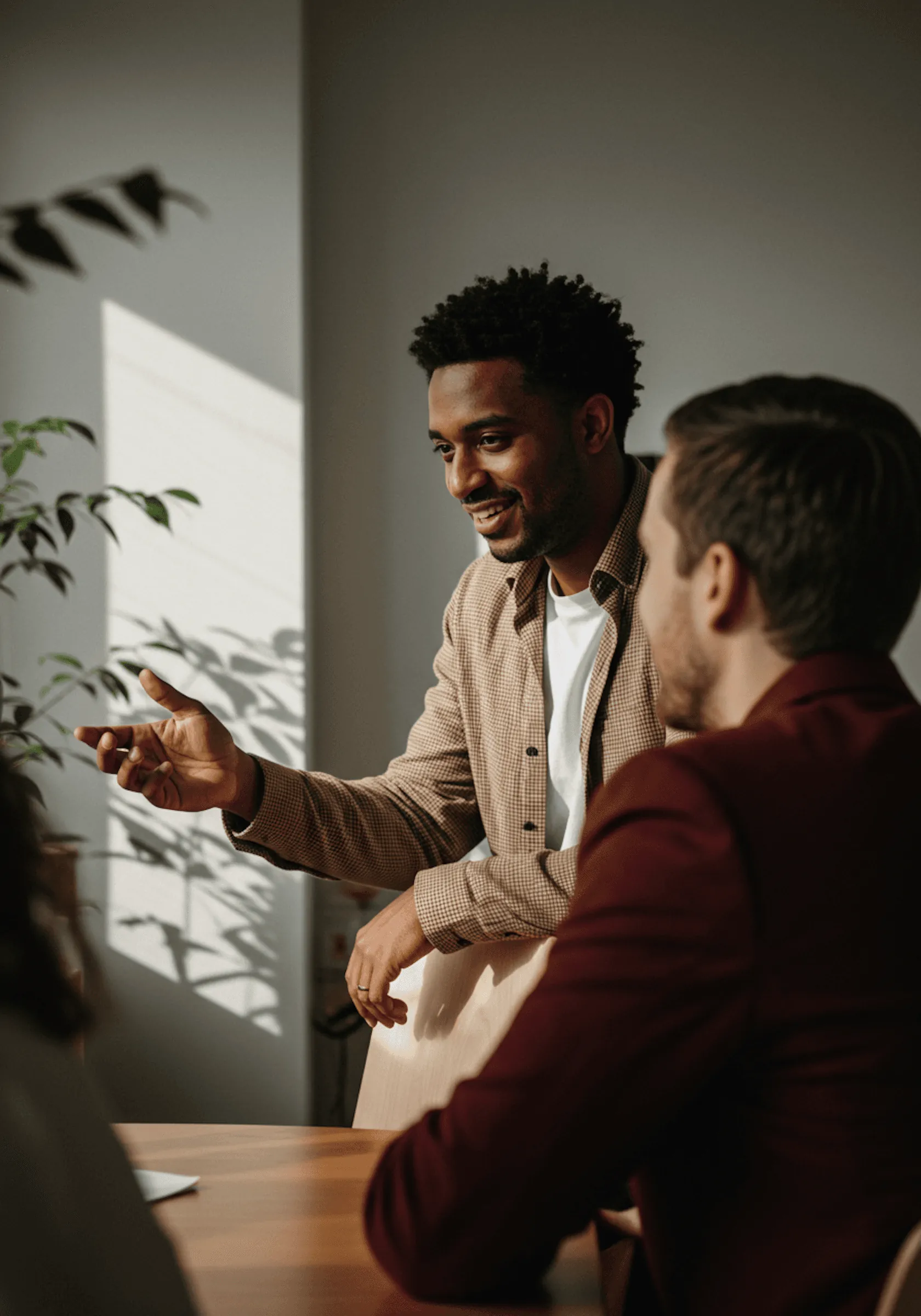 Two colleagues in conversation during a meeting