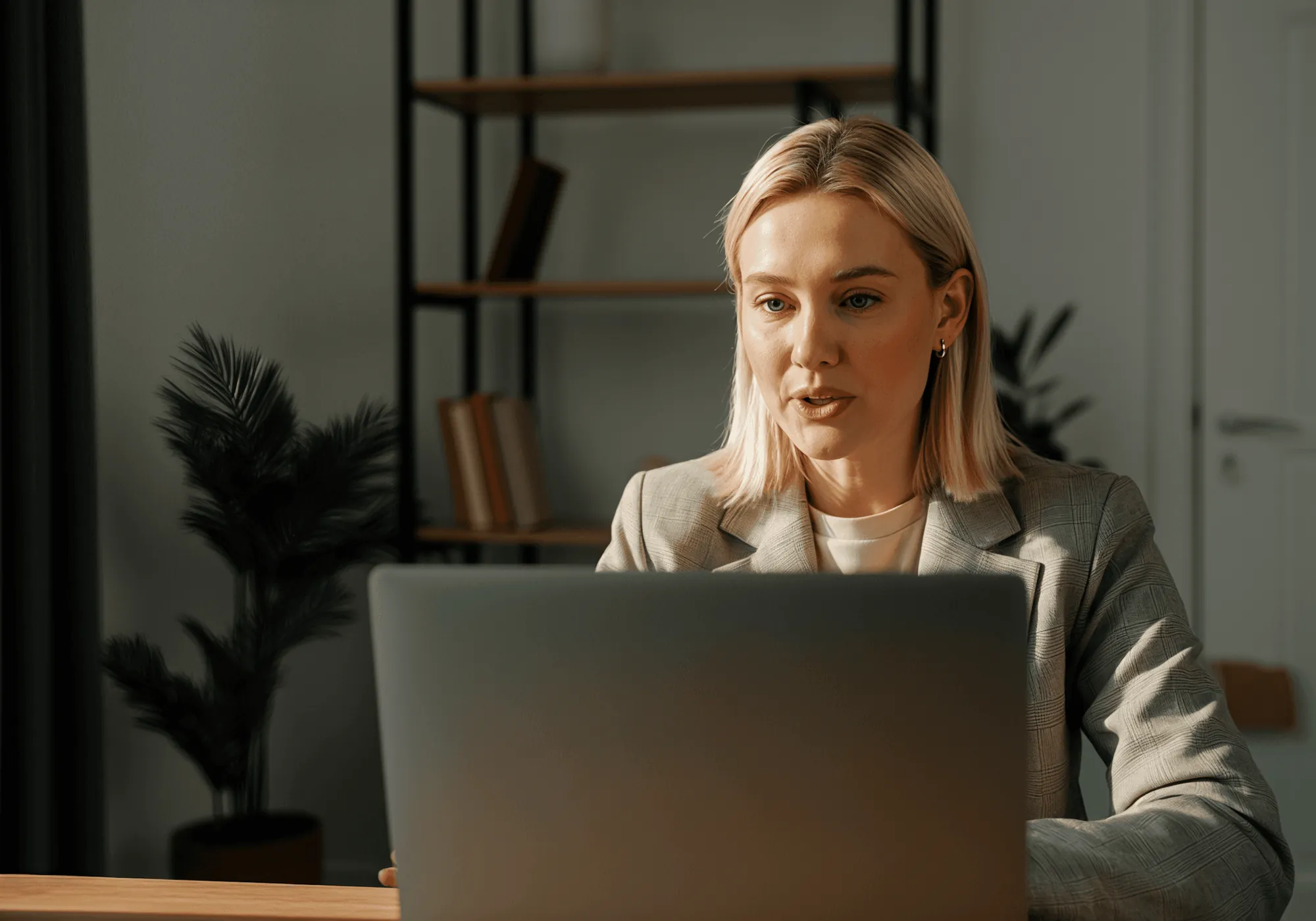 A team member working at a laptop in the office