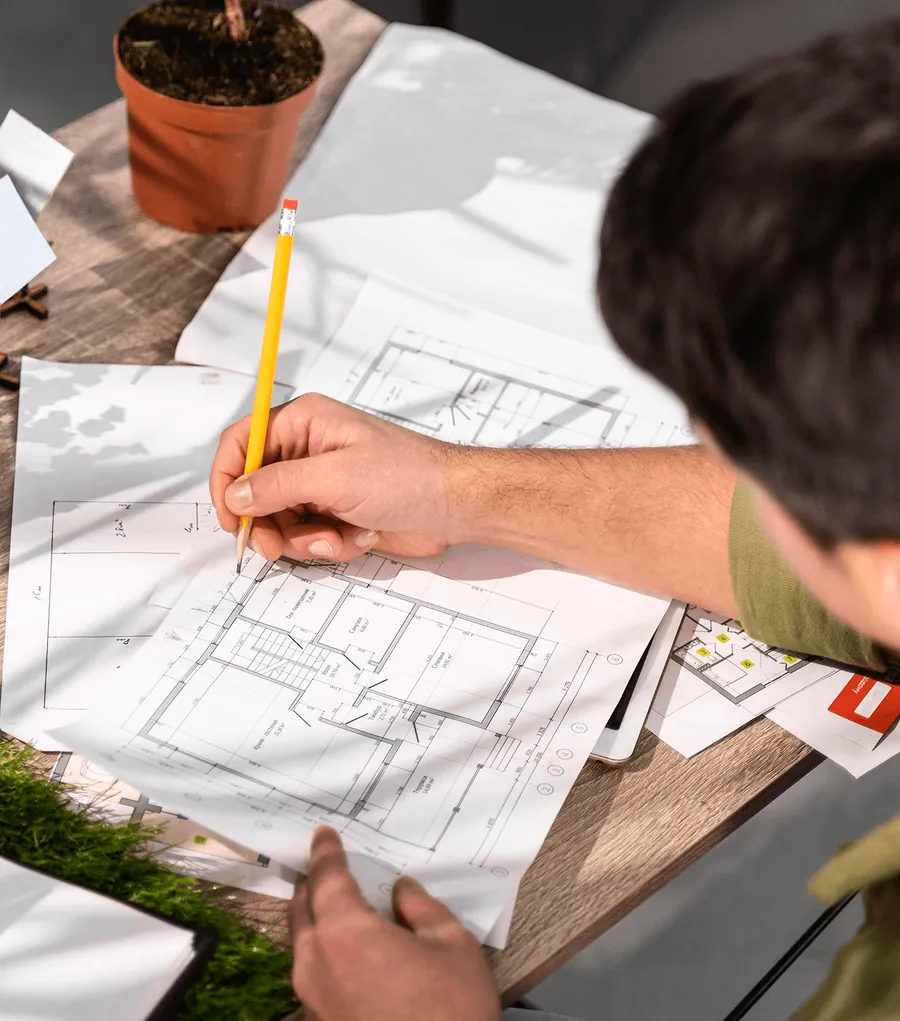 A landscaper sketching a garden plan