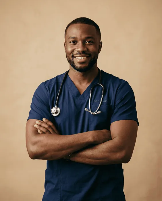 Dr. Marcus Reed in navy scrubs with a stethoscope