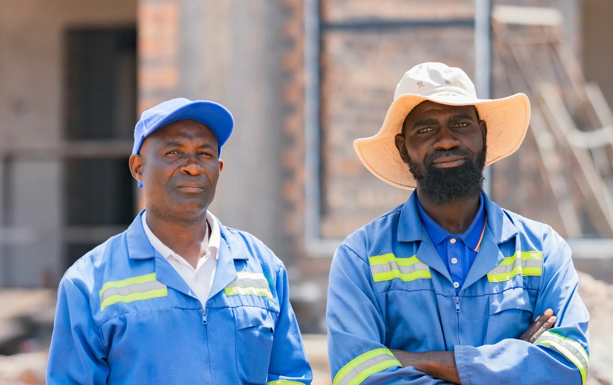 TIDEBOLT crew members in blue work uniforms