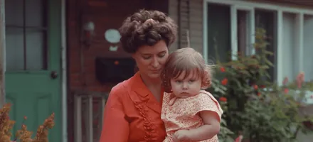A grandmother holding a baby