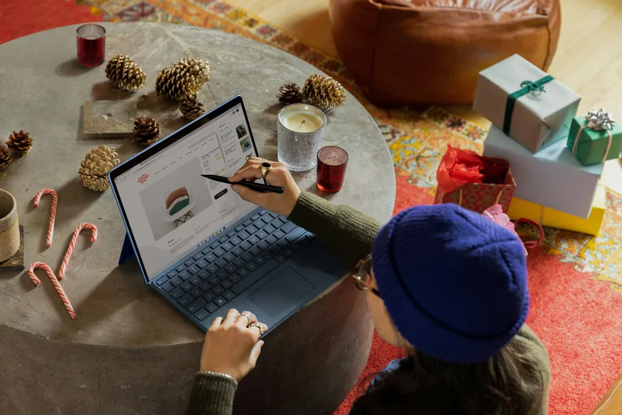 Someone reviewing charts on a tablet at a table