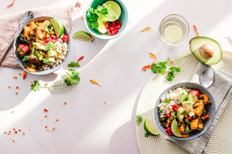 Bowls of colourful salad with avocado