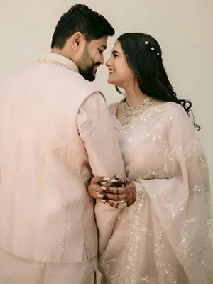 Close-up of the bride in kundan jewellery and henna