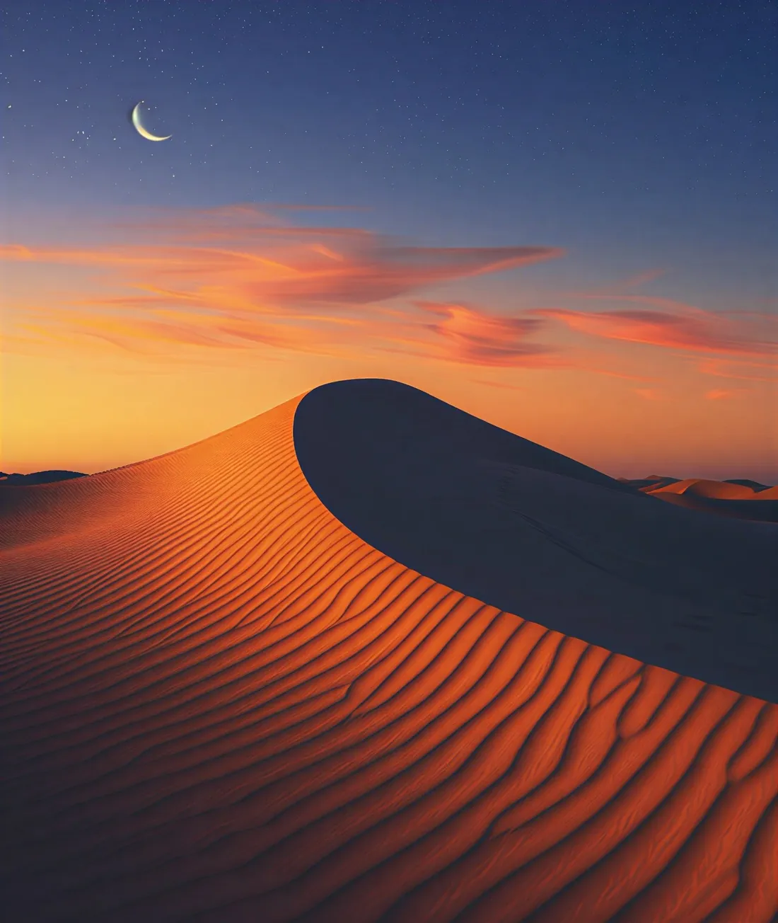 A desert dune under a crescent moon