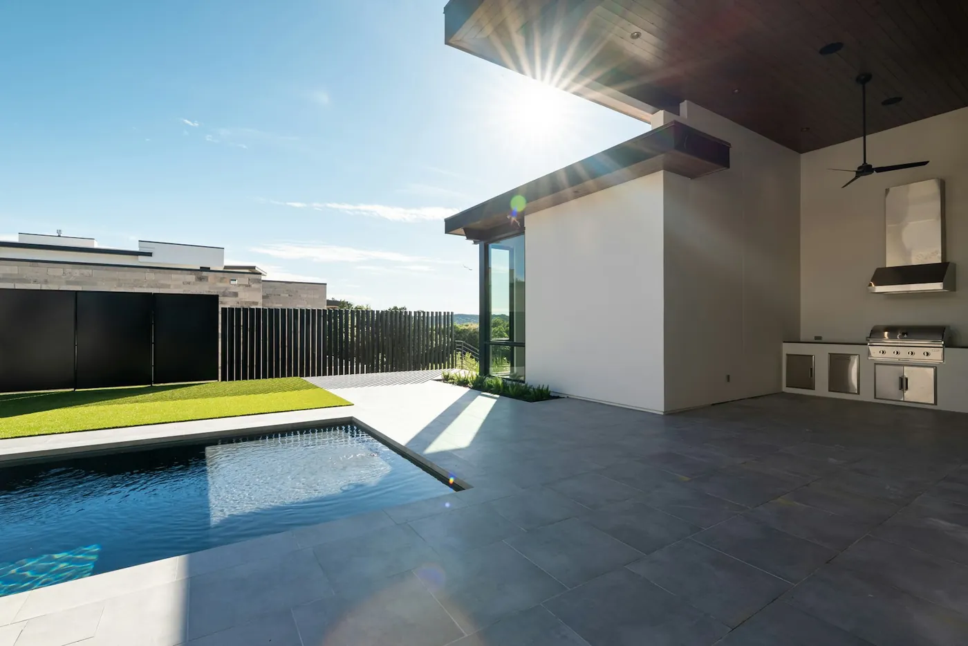 Spotless patio and pool deck of a modern home