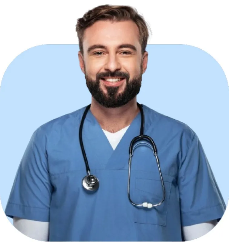 A smiling doctor in blue scrubs with a stethoscope