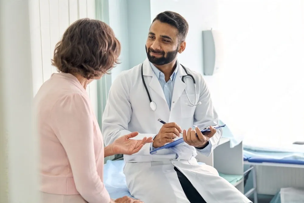 A doctor talking with a patient