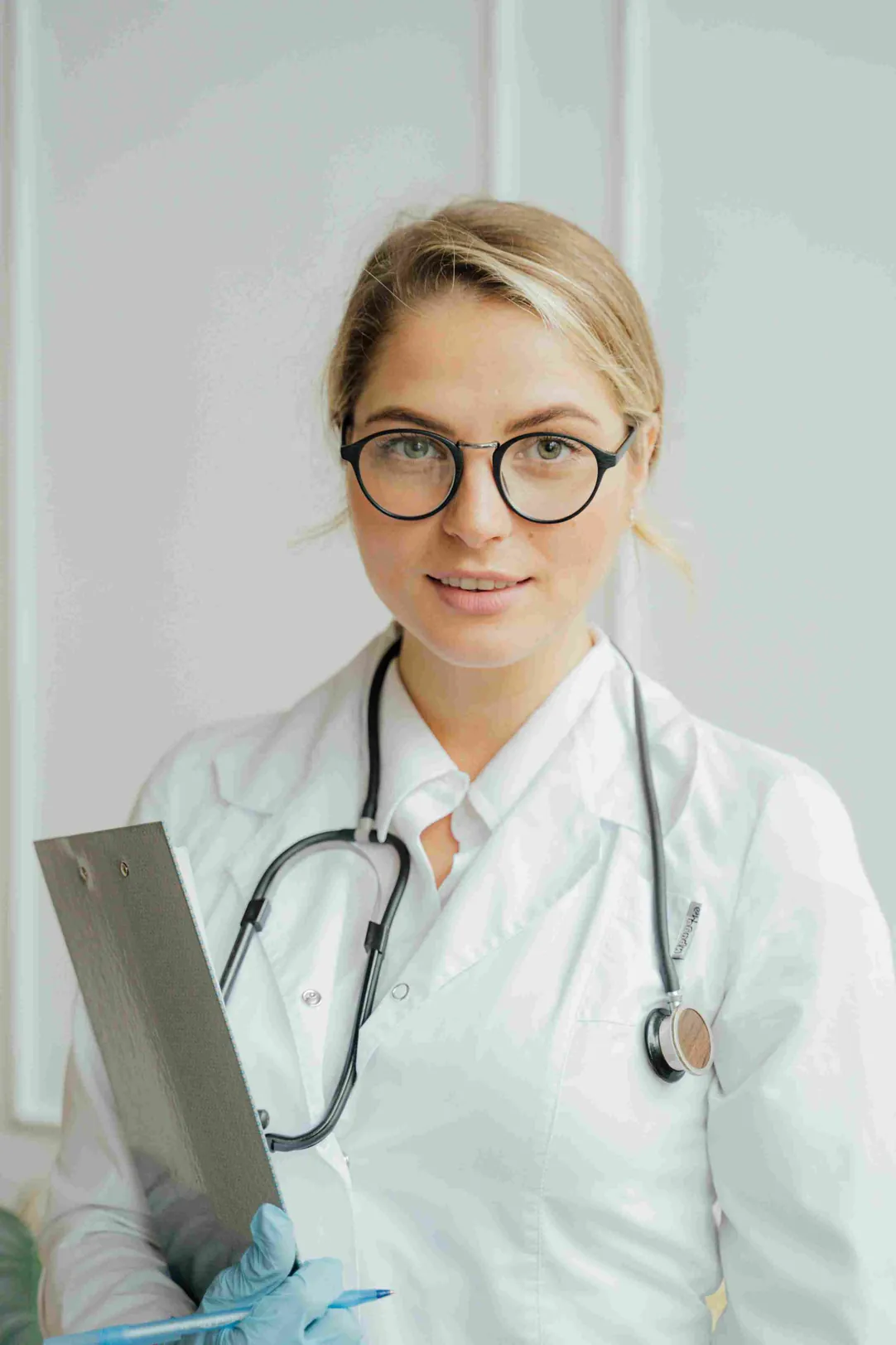 A doctor holding a clipboard